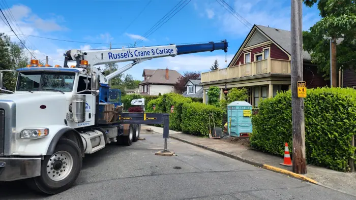 Crane truck working on a residential street