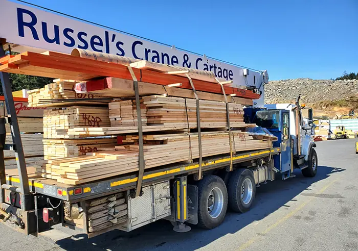 Flatbed truck loaded with lumber for delivery